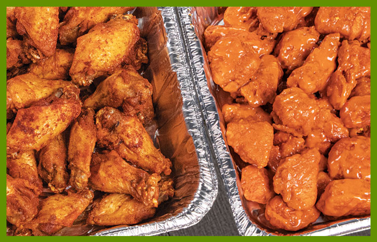 Catering trays of hot wings.