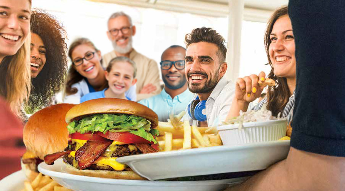 Happy people around a table of food